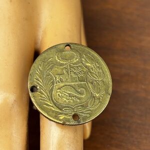 Vintage peruvian bras coin and silveplate spoon  rong